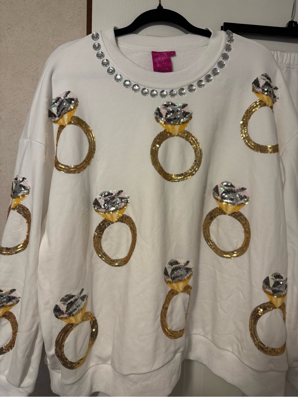 QUEEN OF SPARKLES White Sequin Ring Sweatshirt with Gem Neckline